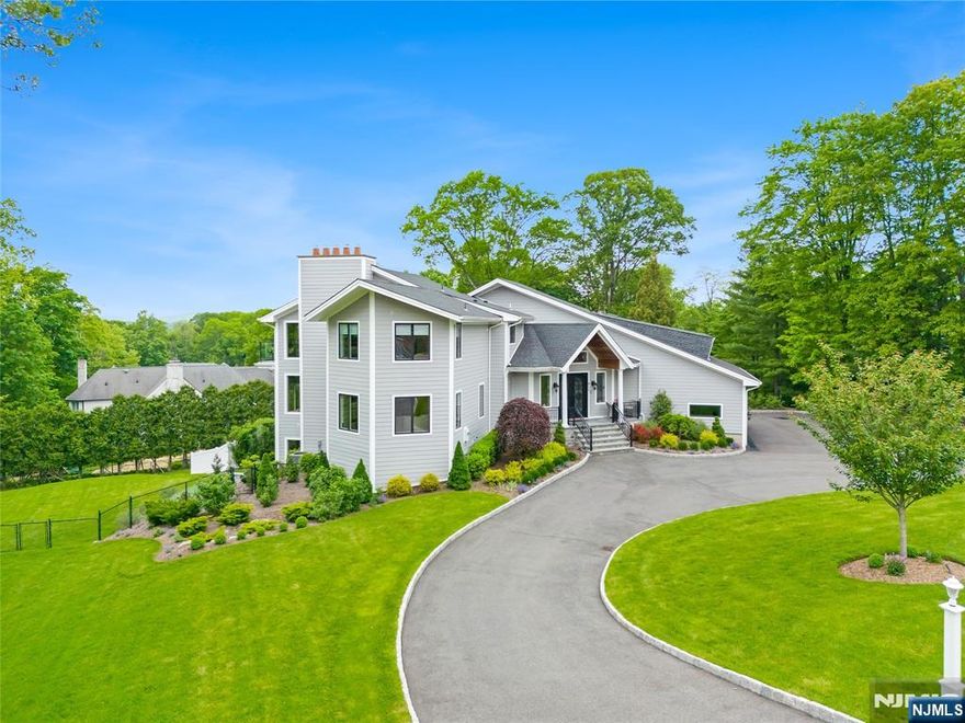 Designer Home 2.0!....Completely reimagined over the past few years this exceptional home features approx.8000sq.ft of living and entertaining space situated on one of Franklin Lakes most coveted streets.The layout of this beauty flows effortlessly & designed for everyday living and grand scale entertaining.This home welcomes you with a grand foyer leading to a central staircase adorned w/crown molding,tray ceilings and custom millwork throughout.Gourmet kitchen offers SS appliances,oversized Xtra deep Quartz center island, floor to ceiling custom cabinetry+ large covered balcony from kitchen & dining room overlooking pool w/waterfalls.Additional adjacent flex space ideal for den or entertainment room.The open floor plan connects both dining and living room as well as the sun drenched Great Rm w/wet bar.Upstairs finds the lavish owners suite,balcony,multiple walk- in closets,LUXE spa like bath w/soaking tub.Additional 3 bedroom en-suites one w/ balcony completing the 2nd floor.The walk out lower level equally impressive boasts a spacious entertainment room w/stone FPL,wet bar,2 beverage centers along w/(3) sets of sliders to patio.Two additional bedrooms with slidering doors also which lead out to the private patio.Enjoy the ultimate backyard oasis with salt water gunite pool, spa, outdoor lounge areas and lush landscaping.Located in an exclusive neighborhood,low taxes and convenient access to dining, shopping and NYC. Don't miss this opportunity!