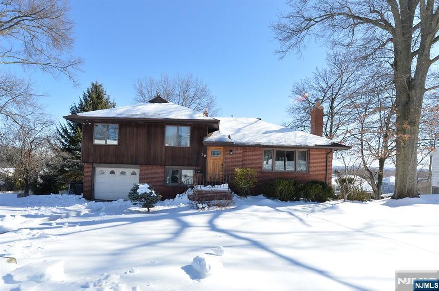 Experience comfort, space, and convenience in this beautifully updated split-level rental, ideally located in desirable Emerson. Offering 4 bedrooms and 2 full bathrooms, this home provides the flexibility and room todayâ€™s renters are looking for. A spacious, sun-filled foyer welcomes you inside and flows into a cozy living room and updated eat-in kitchen,perfect for everyday living. The dining room features elegant French doors that open to an expansive deck with breathtaking, unobstructed horizon views overlooking a beautifully landscaped two-level backyard, creating the perfect setting for relaxing at home or hosting friends. Upstairs, youâ€™ll find three generously sized bedrooms and a full bathroom, while the lower level offers an additional bedroom and full bath, ideal for extended living, a home office, or added privacy. The basement provides ample storage space along with a dedicated laundry area for everyday convenience. Additional highlights include an attached one-car garage and driveway parking for up to four vehicles. Located near top-rated schools, parks, shopping, and with easy access to NYC transportation, this rental offers the space of a single-family home with the convenience of a commuter-friendly location. A rare rental opportunity that truly feels like home. NO PETS DUE TO SEVERE PET ALLERGY