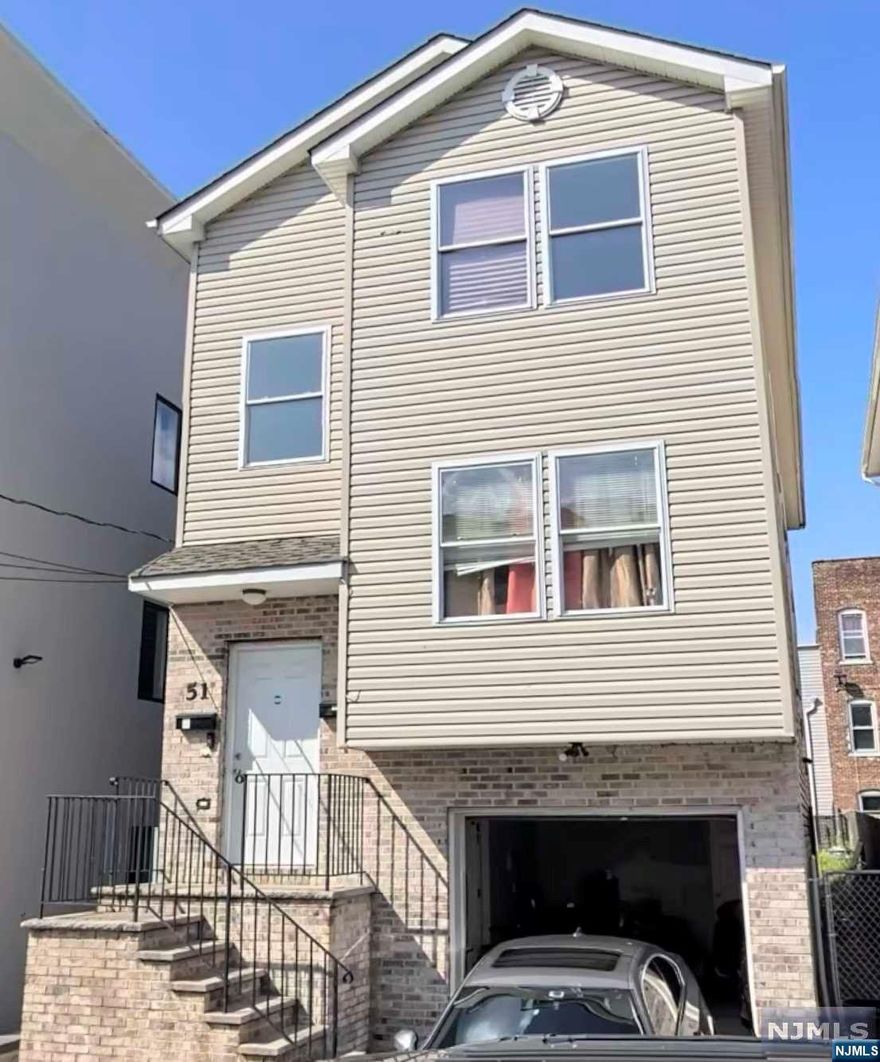 A modern two-family home awaits in this unique abode. Step inside the first floor and find three large bedrooms, two full bathrooms, a living room, dining room and kitchen with an in-unit laundry walk-in closet for added convenience. The second floor features two bedrooms, a living and dining room plus a full bath with its own in-unit laundry. An attached one car garage completes this must-see property. Enjoy easy access to nearby amenities while living comfortably within your own private oasis!