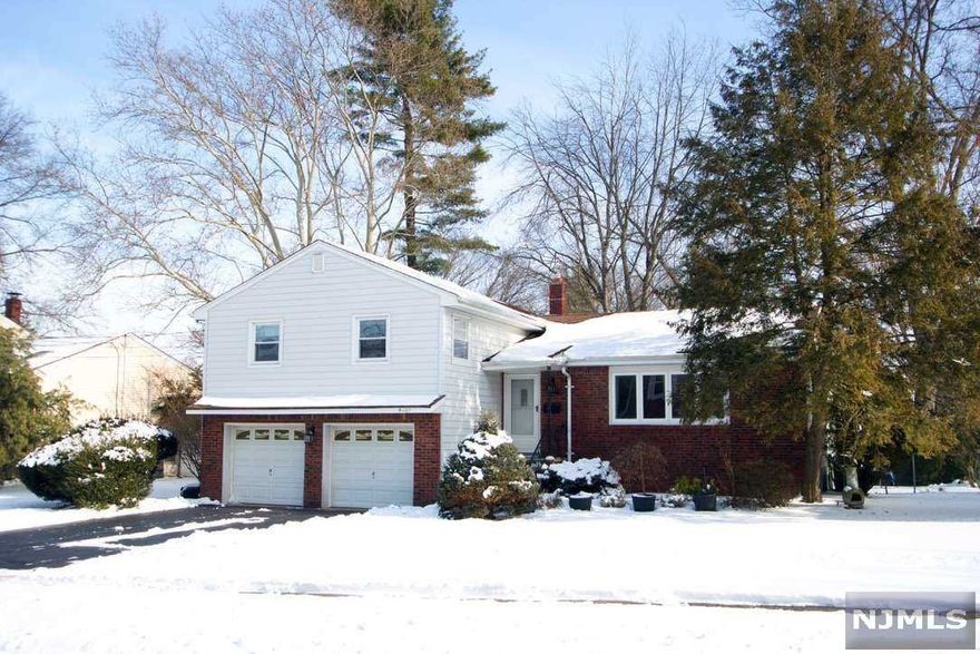 A spacious split-level home, immaculately maintained and on a terrific street. Features a big window in a cathedral ceiling living room. Well maintained kitchen with newer appliances. Central AC and heating. A lovely landscaped property, private fenced-in backyard, and automated sprinkler system. Attached two-car garage with inside entry to den. This property is close to everything: Milnes Elementary School Thomas Jefferson Middle School, and Kindergarten. Close to parks NYC transportation at the corner. Eligible for membership to Memorial Pool. Great home for entertaining. Make it yours!