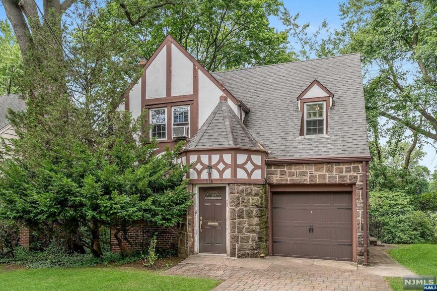 This 3 BR 1.5 bath home has the makings of being an absolute charmer! Situated on a quiet, tree-lined street and backing up to Phelps Park, you are steps away from all things fun! Step inside the foyer of this colonial sidehall tudor-style home and be greeted with warm and welcoming hardwood floors. High ceilings add a grand feeling as you make your way through the LR and DR into the kitchen. Upstairs, you'll find 3 bright BRs with hardwood floors and high ceilings. A private patio backs up to the park making it the perfect place to relax and indulge in the surrounding scenery. One key feature of this home is it's delightful location, situated close to parks, houses of worship, schools and with easy access to NYC and all major highways. Full basement is ready for renovating to make it a comfortable, livable space. Home sold "AS-Is!" Come make this home your dream home! You've got a good start!