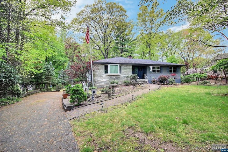 Perfect opportunity to move to a great home situated on lovely park-like property in the highly desirable town of Rive Vale. Entry foyer to LR, DR, MEIK, Laundry, Primary BR w/FB, 2 BR, FB. Access to beautiful deck from kitchen. Lower level has FR w/FP, 1/2 Bath, 1 BR, exit to 2 car garage w/lots of closet storage. Ground level access from lower level. River Vale schools are among the top ranked in NJ according to Public School Review. Close to NYC transportation, GSP, PIP, restaurants, multiple golf courses. River Vale was just ranked 18th in the 100 Safest Cities in the US 2023 according to the Southwest Journal. Home is being sold As-Is.