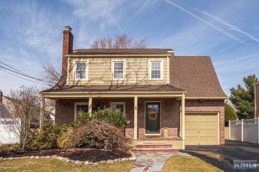 Charming three bedroom Dutch Colonial with fireplace! This solid home feature numerous custom-made embellishments to enhance its beauty. Each window and room has elaborate moldings from an earlier time period. It's clear this home has been well loved. Good size living room opens to formal dining room and country kitchen. Upstairs three good size bedrooms with ample closet space and charming built-in bookshelves. Convenient walk up attic boasting Brazilian cherry wood floor! A generous 132 foot deep backyard ideal for outdoor activities and gardening. One car garage with five car driveway. Gorgeous random-width white oak floors on the main floor and third bedroom. New luxury vinyl flooring in finished basement a great place for exercise or games. An open front porch and central air conditioning make the home comfortable in summertime. Location provides easy access to schools, retail, restaurants as well as commute to NYC.
