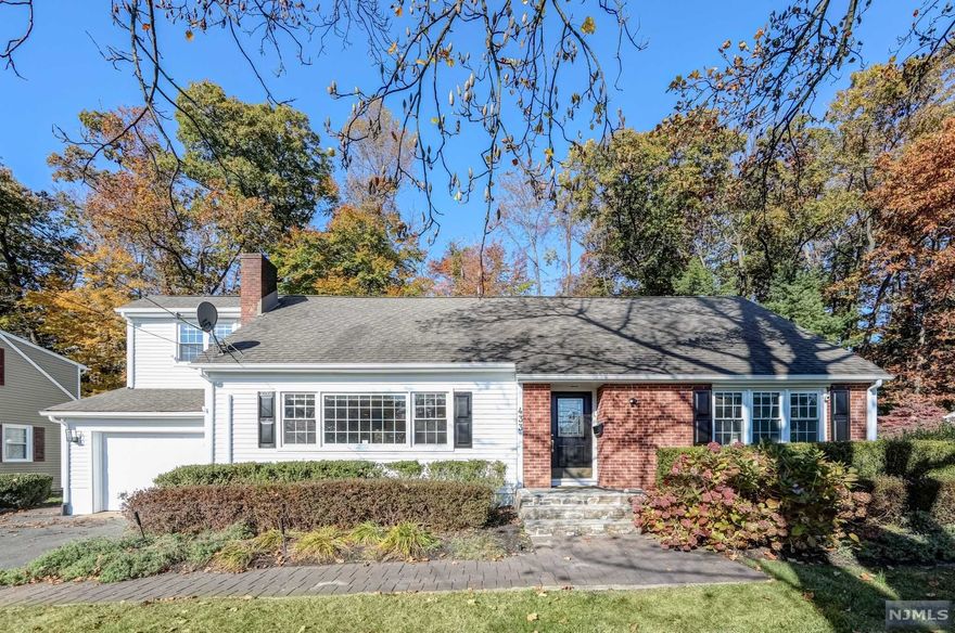 LARGER THAN IT LOOKS! This CUSTOM 4 bedroom 3 full bathroom home situated in the desirable park section of town is 2558sqft. From the moment you enter the light filled living room with wood burning fireplace you will feel at home. Eat in kitchen with cherry cabinets is in the heart of the house and flows seamlessly into the family room. Hardwood floors span throughout. Numerous skylights and 6 oversized sliding glass doors allow lots of natural light to flow into the home as well as overlook the paver block patio and private fenced-in backyard. Two large bedrooms and full bath on the first floor. Second floor boasts another large guest bedroom and full bath in the hallway. Grand Master bedroom with en-suite has double vanity, jacuzzi tub, stall shower, and walk-in closet. Full basement provides plenty of storage or is a clean slate to be finished. Please see video to appreciate all this house has to offer.