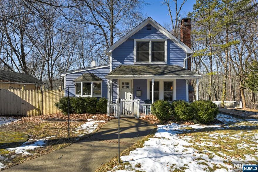 This charming colonial located in the Skyline Lakes section of Ringwood is a perfect blend of historic character and modern updates. The first floor consists of a large eat in kitchen, dining/living room with fireplace, and family room with corner set wood burning stove and sliders out to backyard. The second floor laundry is right next to the bathroom and bedroom with its large walk in closet which was originally the second bedroom of the home. Hardwood floors throughout home aside from kitchen and bath. The park-like property is not to be missed, with beautiful flowering trees throughout the flat front and side yard, and a relaxing nature preserve setting in the rear of the home. The best of both worlds with close proximity to state parks and numerous hiking trails, while having easy access to NYC commuting. Optional Skyline Lakes membership available.