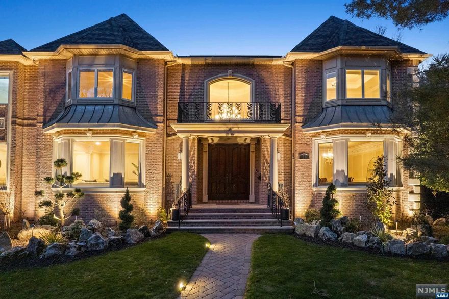 Welcome to a timeless estate, your next forever home nestled on Closter's East Hill. This remarkable residence epitomizes grandeur & elegance boasting unparalleled craftsmanship & attention to detail throughout. The elegant chef's kitchen is equipped with top-of-the-line Subzero & Viking appliances, radiant heat flooring, an oversized island, oversized walk-in pantry, Venetian plaster accent walls, & a sunlit breakfast nook overlooking the serene backyard. A separate wing houses the primary suite, complete with 2 walk-in closets, a marble radiant heat bath featuring a soaking tub, & a separate water closet with a bidet.3 additional large ensuite bedrooms grace the 2nd floor. The lower level offers a retreat of its own, boasting soaring ceilings, a separate bedroom, a full bath, a theater, a spa with sauna, & a temperature-controlled wine cellar. Poured concrete foundation & Andersen windows are just some of the custom features.Come experience it today !