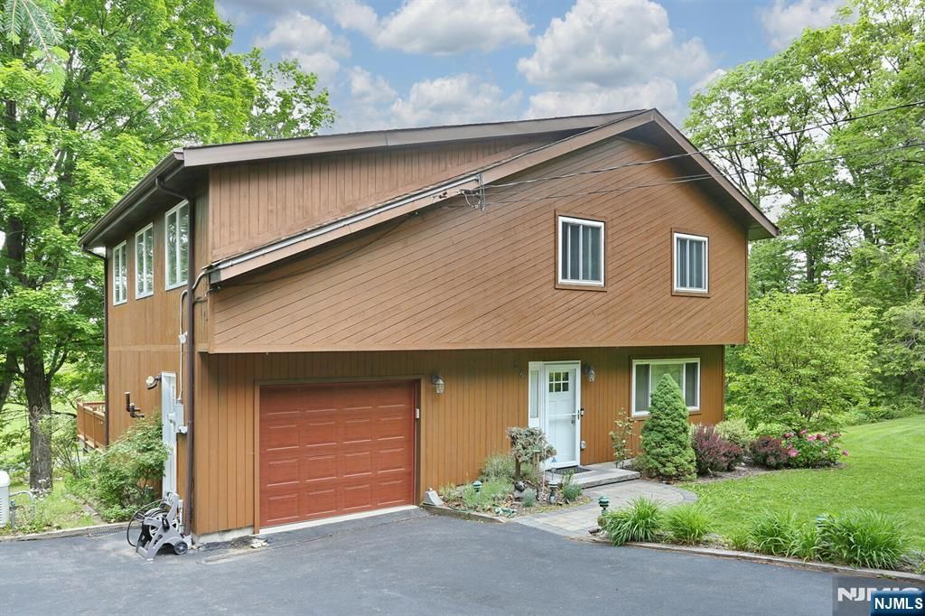 Photo of 64 Larchmont Drive, West Milford, NJ 07421 (MLS # 26011559)