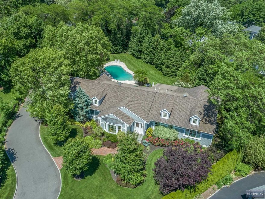 Stunning, "smart," and sophisticated 5 bedrm, 4 full bath contemporary home located on a private cul-de-sac in desirable Upper Montclair. True one-floor living stylishly renovated with a clean and discerning eye. A cascade of light guides you immediately through the spacious living and dining areas highlighted by a dbl-sided gas fpl into the modern, clean lined kitchen precisely designed for form and function. This chef's kit is fully open to the adjacent famrm. Imagine a glorious gathering space overlooking the expansive backyard beautifully landscaped w/newly resurfaced salt water pool, patio+hot tub, a fun and relaxing oasis of your own. The primary ensuite bedrm is a serene get-away featuring a gas fpl,walk-in closet and spa-like bathrm. 2 add'l bedrms,one ensuite,and hall bath plus guest suite+an additional bedrm perfect for a home office. Finished b'ment offers a large recrm>m. This house is "smart!"Control the lights, security, entertainment center all from your phone.