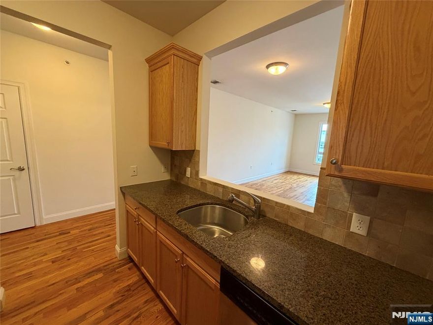 1 month free on 13 month lease! Modern one bedroom unit available on 2nd floor of elevator building with hardwood floors throughout, high ceilings, kitchen featuring granite counter tops and top of the line stainless steel appliances, central air conditioning and intercom system. Spacious layout. Light and bright. **Reduced rent security offered to qualified applicants! **Laundry room on floor. **One assigned parking space included in the rent. 2nd parking space: $125/month. **pet allowed (limit and fee applies) **Tenant responsible for all utilities. **Desirable location less than 1 block to NYC transportation and downtown Hillsdale shopping, restaurants, and more! Ideal for commuters! Available immediately!