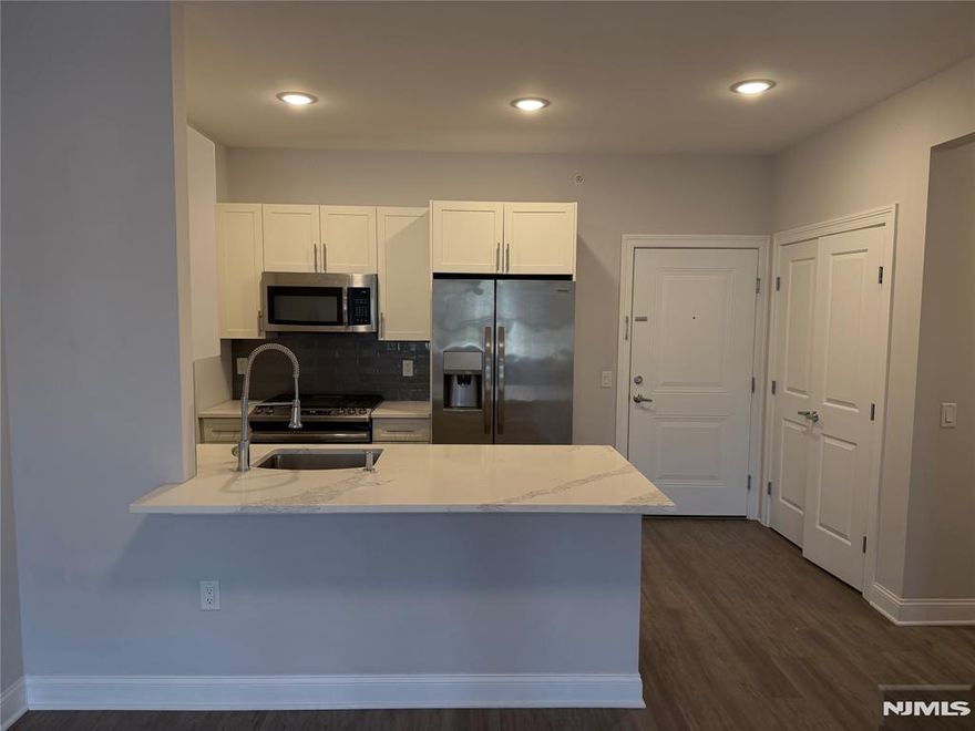 **FIRST MONTH FREE on a 13-month lease + one parking space included! - for occupancy commencing on or before 5/1/26!** Modern 2 bedroom apartment (AVAILABLE IMMEDIATELY on TOP FLOOR) with ample living & closet space. 40 Park features modern units with spacious floor plans & high end finishes. Some highlights include: beautiful modern kitchens with stainless steel GE appliances, full kitchen island, wood floors, large washer and dryer in each unit. Blocks away from the train for easy access to New York. Within blocks to all Park Ridge has to offer including brand new stores and restaurants. Less than 5 minutes from the brand new Shoppes at Dipiero Farms - featuring Wegmans, Chipotle, Starbucks and much more. PARKING - 1st assigned [outdoor, some are covered but can't guarantee a covered] space INCLUDED IN THE RENT! 40 Park Ave is pet friendly (lb limit + fees apply)! REDUCED rent security deposit offered to qualified applicants! Tenant is responsible for ALL utilities! Move-in fee applies! Virtual tour available upon request!