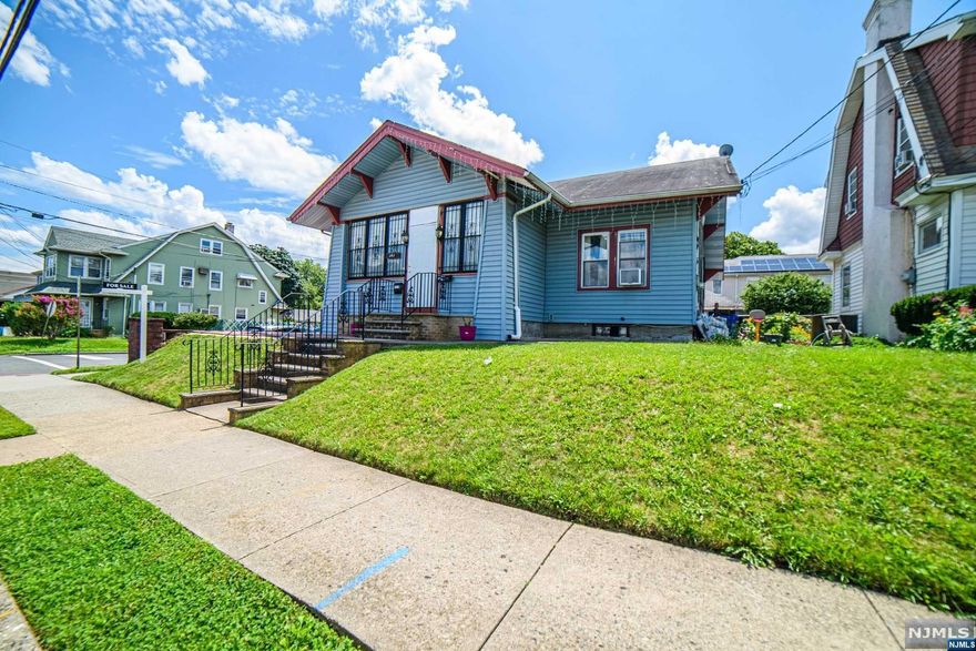 This home is located in one of Paterson's most desirable areas! There is ample space, 1st floor offers am enclosed porch, followed by an open Living room and dining room, 3 generous size bedrooms, and a full bathroom on the 1st floor. 2nd floor offers an additional two bedrooms, with closet space! The basement is finished and includes a kitchenette, full bathroom, 3 large rooms for extra living space, and a separate independent entrance! This homes also offers a generous size backyard, perfect for some summer time shindigs! In addition there's a 2 car garage with extra blacktop parking available!