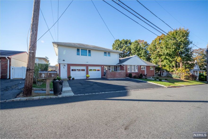 Custom built 2 family, first time for sale by original owners. Owner occupied for over 60 years! Solid Built using 10 inch bricks on the entire first floor exterior. Separate Utilities, laundry, Central Air, and Heating. This is a true two family home. First floor features updated Eat in Kitchen, Dining, Living, Den, 3 beds, and 2 full baths. Second floor feature Eat in Kitchen, Living, 2 beds, and full bath. Full finished basement with outside entrance, full bath, slop sink/laundry area, storage room, bar area, and large open common area. Fantastic views from the backyard, come enjoy the fresh air. Close to pub trans, store, and schools.