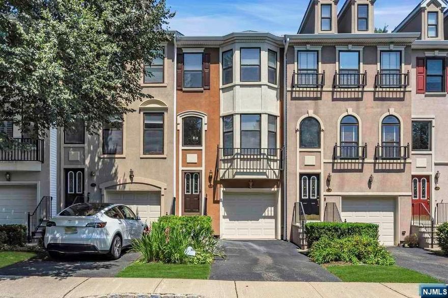 Beautifully Renovated move-in ready Two-Bedroom Townhouse in Prime location near the end of the Cul-de-sac in prestigious Cambridge Heights, a gated community less than 9 miles from NYC. Main level offers an Open Floor plan with Newer Hardwood floors, Center Island w/ Quartz counters, and Stainless Steel Appliances, open to Living Room with Fireplace. Separate Dining Entertainment Room! Spacious Owners Suite with Vaulted Ceilings, Large Closets, Full bath w/ Whirlpool tub, Shower Stall, Double Vanity. Lower-level floor with updated Floors & Built in Murphy Bed! Full Day Light & Walk-out to Private Newly extended Patio open to Beautiful Open Space!, Gas Hook-up for Grill! Garage with Additional Parking! New Roof! Amenities include Pool, Clubhouse with Exercise Room, Tennis courts, Jogging path! Maintenance Free Living