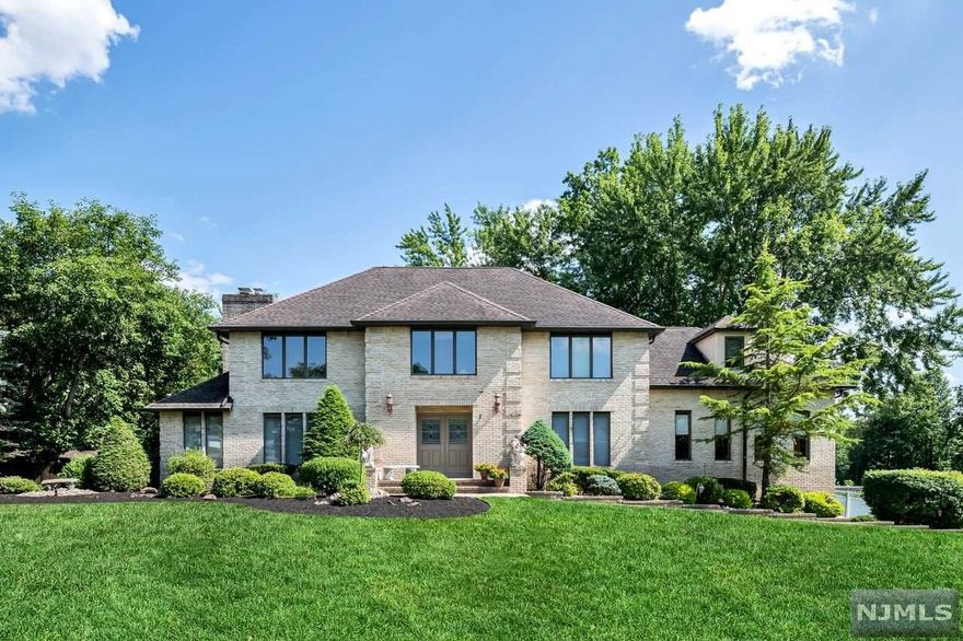 On a quiet Cul De Sac sits this Stunning Custom Built Totally Updated meticulously maintained Colonial. All Brick beautifully landscaped 4 BDR, 3.1 Bath with approx. 4,000 sq ft of living space. Gourmet kitchen with top of line appliances, center island, granite, SS, custom cabinets & beverage center. LR w/French doors, fireplace and formal dining room. Family room which gives a feeling of comfort & relaxation with an additional sun filled Large Great Room. Second level offers amazing master bedroom suite w/ jacuzzi tub, double sinks, semi frameless shower doors & his & hers walk in closets, sitting area & 3 generously sized bedrooms with additional full bath. Full finished walk out basement offering plenty of space to entertain with kitchen, full bath & loads of storage. Vacation at home in your very own private oasis with a heated, salt water, gunite pool with hot tub & cool decking patio thru out. Home has so much to offer. Top Rated Schools, Close to NYC Trans