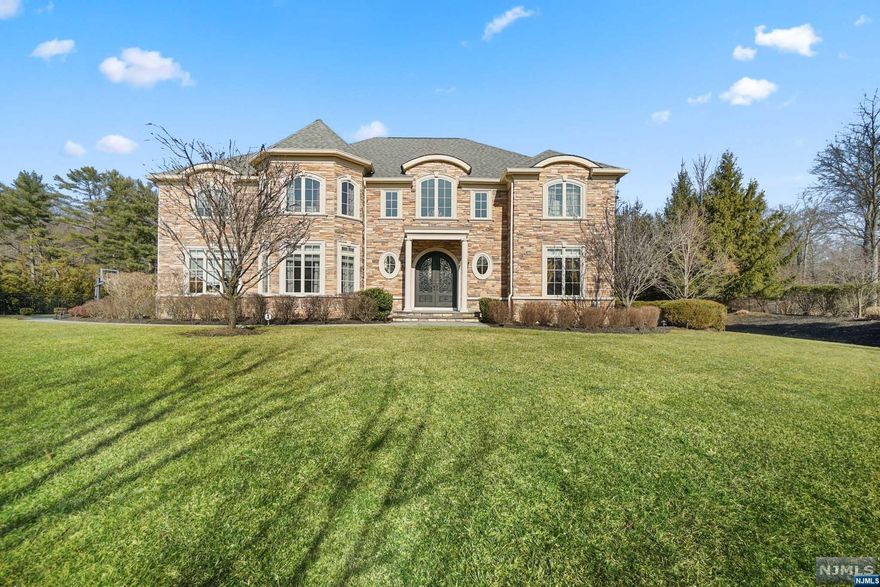 Serenity in Palisades NY! This magnificent estate boasts a stone exterior and meticulous grounds. Close to Tallman Park, offering Hudson River views, hiking, jogging paths, biking trails, and a weekly farmers market. The grand entrance features a 2-story Foyer and curved staircase, leading to an open floor plan dream kitchen with Thermador stainless appliances, expansive center island, granite countertops, pantry, butlers pantry/bar area, and formal dining room. The great room with Fireplace and veranda with a 2nd Fireplace, sound system, and TV. The first floor also has 2 large rooms for possible home offices or bedrooms with full bathroom, and 1/2 bath. Primary suite offers 2 oversized walk-in closets, radiant heated bathroom with luxurious steam shower. Pella windows, extra wide HW floors, recessed lighting, crown moldings, wall panels, hydro-air and radiant heating, exterior irrigation, lighting, and sound speakers. A three-car garage is an added bonus. Renderings for a pool.