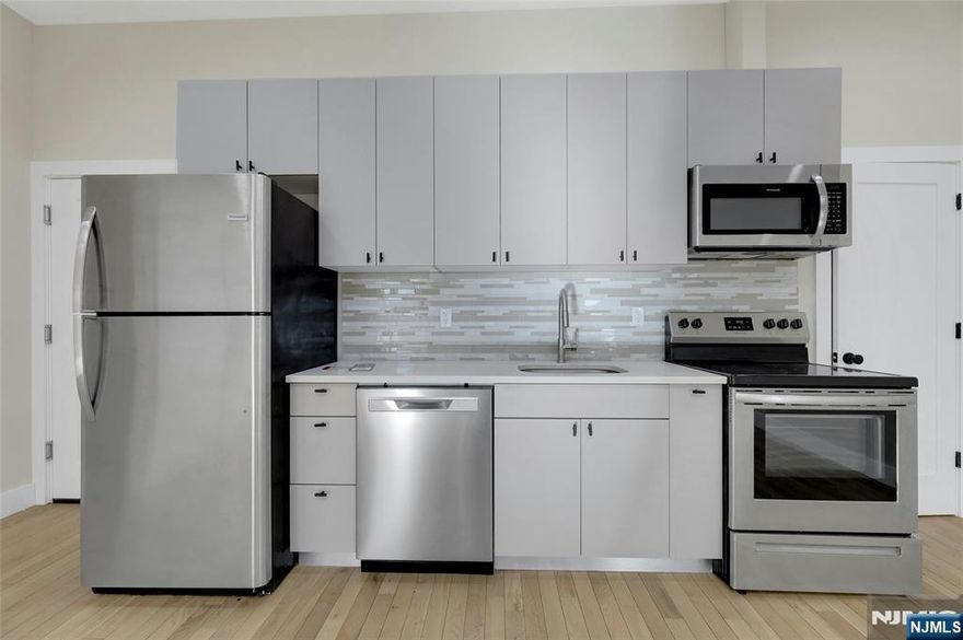 Stunning 2-bedroom, 1-bath apartment with modern finishes, hardwood floors, and a bright open layout. Enjoy a sleek kitchen with stainless steel appliances, dishwasher, and in-unit laundry, plus ample closet and storage space throughout. Perfectly located near Columbia Park Center Mall, grocery stores, restaurants, and daily essentials. NJ Transit bus stop right out front, and the municipal parking garage is less than one block away. This incredible unit wonâ€™t last, schedule your showing today before itâ€™s gone!