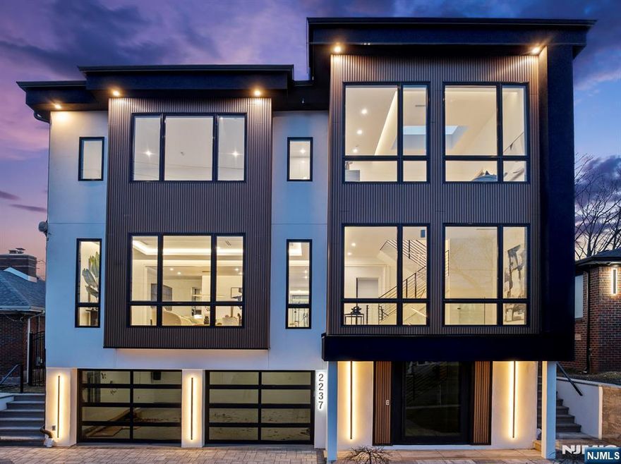 Watch the video! https://njproper.com/mls-2237-jones Luxurious 7,000 sq ft new construction home w/ 6 bedrooms & 7 bathrooms. A stunning black glass-enclosed 2-car garage, plus 2 additional parking spaces, offers convenience. The home boasts a dedicated wellness center with a Finnish sauna, and a glass-walled gym w English imported panels. Enjoy a private movie theater, basement bar with beverage center, and a gourmet kitchen featuring 2 Calacatta Jade Black waterfall islands, glass enclosed wine display, and top-tier appliances including Wolf, Dacor and Miele. The expansive outdoor lanai includes a fully equipped kitchen with BBQ, griddle, and beverage center, plus an in-ground pool, jacuzzi & sun shelf. Gas fire table. Elegant living spaces include a formal living and dining room, informal living room, and a 3rd-floor landing with abundant natural light. The primary suite offers 3 closets, a private balcony, & a spa-like bath. Custom wood fluted paneling & metal railings