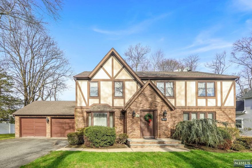 Welcome home to this beautifully maintained tudor in the great town of Closter. Lovely 4 bedroom 2.5 baths. First floor with entry foyer, dining room, living room, family room with sliding glass doors to the deck and wood burning fireplace, eat in kitchen with sliding glass doors also to the deck, half bath, laundry area and entrance from the garage. Second floor has a primary bedroom with full bath, walk in closet and vanity area. 3 additional large bedrooms and a full bath. Pull down stairs takes you to the attic with plenty of space for storage. Central Air Conditioning. Full unfinished basement with nice high ceilings. Two car attached garage and plenty of parking spaces. Property is 0.31 of an acre. Home/property is being sold as is. Come see this home and make it your own! Original owner and never before listed. Close to the Closter Plaza and just minutes from NYC!