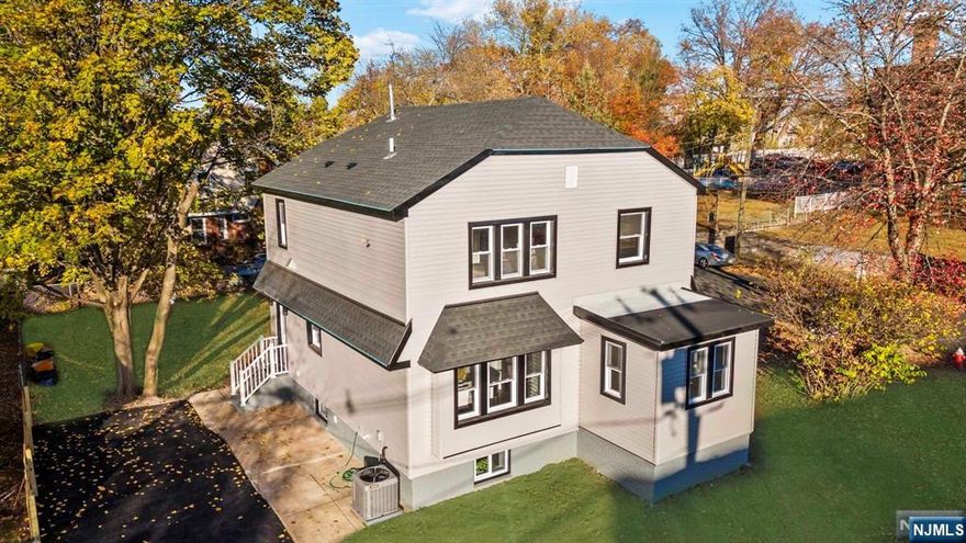 Super gut renovation with no expense spared, this Teaneck home offers the finest in modern living. Boasting stunning hardwood floors throughout, the open-concept design is filled with natural light. The kitchen is a true highlight, with top-of-the-line stainless steel appliances and a stunning island perfect for both cooking and entertaining. The first floor includes a convenient half bath, while the second level offers 2 full baths and 3 spacious bedrooms, each with generous closets. The fully finished basement provides extra living space, complete with a full bath. Additional upgrades include a new roof, plumbing, electrical, and central air. Situated on a large corner lot of over 7,000 sq. ft. in a quiet residential neighborhood, this home blends luxury, style, and comfort.Don't Miss Out on This Incredible Opportunity and schedule a Private Showing now !