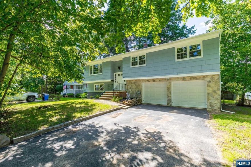 Beautifully renovated 4 bedroom 2.5 Bath home in sought-after Caldwell on a quiet street with a water stream by the driveway! Walk up to the main floor to see your spacious open-concept kitchen, LR & DR. Kitchen has SS appliances and everything a chef needs including a large island and plenty of counter space! Hardwood floors across the home, and ample closet space in every bedroom. The main Bath has a tub while the master bath has a stand-up shower. The master bedroom has a walk-in closet as well. Walk downstairs to find the final spacious bedroom with a closet, a fully finished basement with a half bath, a laundry room with hookups, and a large 2-car garage with automatic remotes. Finally, the home has a walk-out deck from the dining room that leads to the large backyard. This outstanding FULLY RENOVATED home with Central A/C & Heating is GLOWING with natural light and is ready for move in. In walking distance to many local shops, bars, restaurants, and parks.