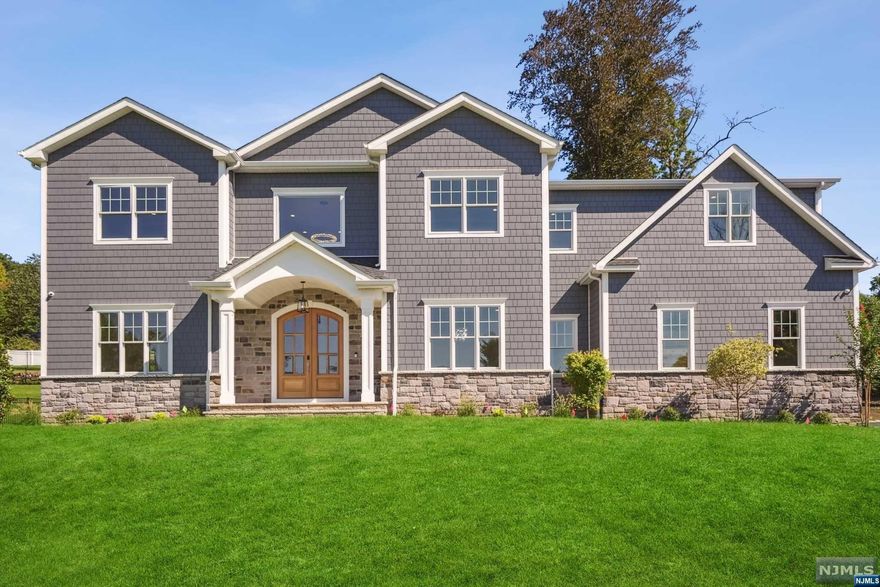 Impressive Custom build with 6,400 sq ft of finished living space. This beautifully appointed home has 10ft Ceilings on 1st Floor & 9ft ceilings on 2nd & LL. Grand Foyer welcomes you with Herringbone HW Floors, Formal Living Rm, Dining Rm, Magnificent 2 Story Family Room w/ soaring windows & 2 sets of French Doors on either side of Gas Fireplace leading to your Backyard Entertaining Space. Custom Kitchen w/High End SS Appliance Package, oversized Center Island, Quartz Counters, Butler's Pantry, Walk-in Pantry and Sun-drenched Breakfast Room. Mudroom, Powder Room & access to 3 Car Garage complete 1st Floor. Primary Retreat with Gas Fireplace in Bedroom &Juliet Balcony, Large Walk-in Closets & Spa Primary Bath with soaking tub, heated floors and a jetted shower. Three additional Secondary En Suite Bedrooms and Laundry complete second floor. Finished walkout basement with Bedroom, Full bath, Rec Room, 2nd Laundry and Wetbar.