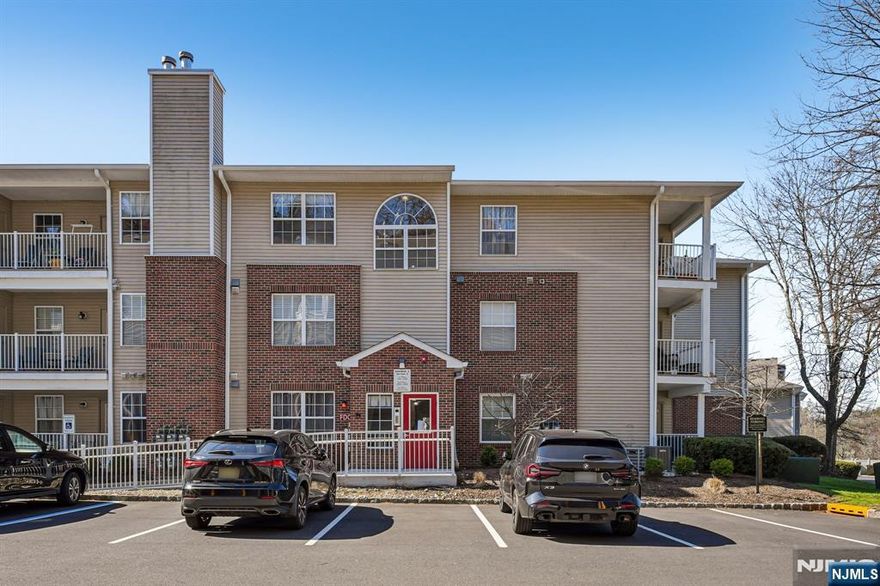 Welcome home to this beautifully maintained first-floor, 2-bedroom, 2-bathroom Condo located in the highly desirable Crescent Court community. Step into the entry foyer, which opens into a bright and inviting living space filled with natural light from a large window. The living room offers a comfortable setting for both everyday living and effortless entertaining, with direct access to a private balcony perfect for outdoor dining, morning coffee, or relaxing with a good book. The living room flows seamlessly into the dining area, creating an ideal space for intimate meals or hosting gatherings. A large cased opening leads into the tastefully updated kitchen, featuring custom cabinetry, granite countertops, stainless steel appliances, and a convenient pantry. The spacious primary bedroom serves as a private retreat, complete with a walk-in closet and en suite bath. A second generously sized bedroom also features a walk-in closet, offering excellent storage and flexibility. Additional highlights include a second bathroom, in-unit laundry and utility room, a dedicated garage storage locker, along with ample guest parking. Enjoy the lifestyle Crescent Court has to offer, with pet-friendly green spaces, peaceful wooded walking trails, and a community room for hosting events. Conveniently located near NYC transportation, shopping, and dining, this home offers the perfect blend of comfort, convenience, and low-maintenance living.