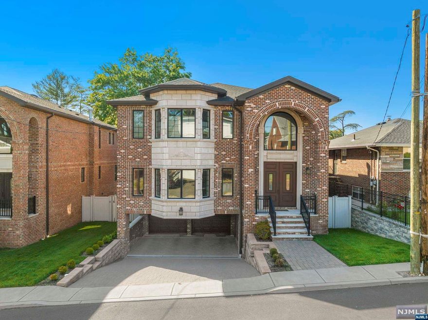 Jason Pierce 201-397-5888 and The NJProper team presents: Pristine brick home in a great location near transportation, schools, and Inward Terrace Park! Built in 2020 with quality materials and exceptional craftsmanship. Great attention to detail is evident both inside and out. Spacious rooms, quartzite kitchen w/ high end appliances, coffered ceilings, master suite w/enormous closets/dressing area and jacuzzi tub, radiant heat, 2 laundry rooms, beautiful moldings and trim work throughout. Paver walkway and patio, 2 car garage with carport. The VIRTUAL TOUR link for this listing contains an enormous amount of relevant information including a comprehensive video tour with hidden features & room dimensions, written description, additional photos, floor plans, and a complete interactive 3D model of the home.