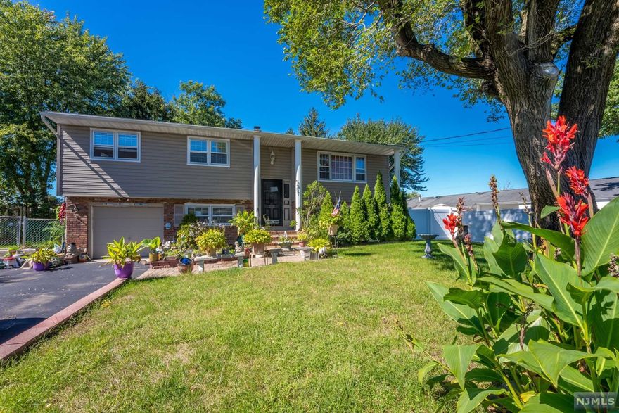 It's time to come home! Pride of ownership shows in this 4-bedroom 2 bath move in ready split-level house! Featuring new roof, central AC, updated bathrooms and kitchen. This home has it all. Granite countertops; hardwood floors and plenty of closet space. Garage that also offers a workspace. Spacious fenced in backyard with a special addition "workspace shed and storage. New wooden pergola deck. This backyard is perfect to relax and unwind or celebrate with loved ones! Excellent for commuters as it is a short distance to the Garden State Parkway. Close to shopping and the beaches. do not Miss this beautiful One