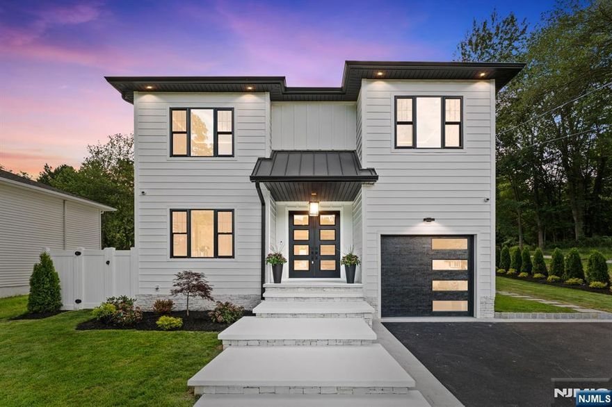 Nestled on .34 acres, 281 N Livingston Ave is a brand new construction home on new foundation, ready for its new owner! Loaded with smart technology throughout, a high end security system, 6 zone sprinkler system, state of the art stereo system speakers in every room that can be controlled via iPad; installed upstairs and main level. Every window is hardwired to have power blinds installed easily, and built in WiFi. The kitchen is a true beauty, equipped with Zline Autograph Collection appliances and a 11 foot quartz/porcelain countertop island with additional cabinetry, flowing nicely into the open concept living room. Upstairs, 4 bedrooms all with LED lighting throughout the Cove ceilings. A Jack and Jill bedroom and full bathroom with sleek designs and a guest en-suite, both with heated floors. The primary bedroom is a dream that features a custom bathroom designed with spa features, soaking tub, and also with heated floors.Finally step outside into the backyard oasis that is decked out with serene waterfalls on a pavered patio that can be your place of tranquility alongside a fire pit and surround sound system. In all this property features 5 bedrooms, 3.5 baths, approx 3300 sq ft of finished space, attached garage, large driveway for multiple cars, space in basement for another potential office or gym, 10 year builders warranty and access to an excellent school system, proximity to a variety of shopping centers, dining options, and major highways with easy access to NYC.