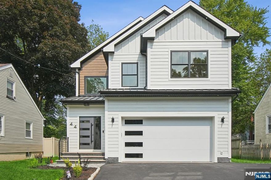 Experience modern luxury living in this NEW CONSTRUCTION custom home, offering nearly 4,000 sq. ft. of finished space across three levels. A grand 20-ft foyer welcomes you into an open-concept first floor with 9-ft ceilings, a formal dining area, and a spacious family room with a gas fireplace. The gourmet EAT IN kitchen boasts HIGH-END appliances, two-color cabinetry, and stunning quartz countertops and backsplash. An elegant center Island with pendant lighting has additional cabinet space. A FIRST FLOOR BEDROOM suite with an attached full bath, plus a mudroom off the two-car garage, adds convenience. Upstairs, the PRIMARY BEDROOM features a tray ceiling, two closets, including a custom walk-in closet, and a spa-like bath with a soaking tub, water closet and a standalone shower. Three additional bedrooms include a junior suite, and a full laundry room completes the second floor. The finished basement has high ceilings, offers a WET BAR, rec space, a SECOND LAUNDRY ROOM, a PET FRIENDLY SPA shower, and an optional sixth bedroom or office with an adjoining full bath. The sixth bedroom could easily be converted to a workout room, home office or THEATER room. Outdoor living is enhanced with a paved patio and PRIVACY FENCED BACKYARD. SMART HOME features include an EV charger and NEST thermostats. Located in Livingston, home to top rated schools, this prime location offers easy access to NYC transportation, major highways, houses of worship, shopping, and more.