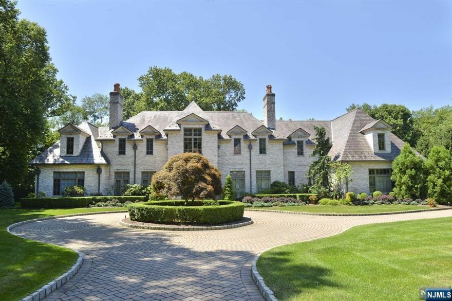 2000's built French Chateau situated on 2.33 gated and fenced acres with pickle ball/sport court and lagoon pool with waterfalls. This all brick manor offers slate roof and copper leaders and gutters and is in pristine, move in condition. Elegant woodworking and high ceilings throughout, 3 woodburning and gas fireplaces, curved entry stairs plus back staircase, Large 1st floor primary bedroom. 2nd fl. media room/2nd primary bedroom, Lower level has outside entry, 9 seat theater, stone enhanced wine cellar, monitored security with cameras. 4 car garage on grade, and extensive landscaping. Both city water and private well.