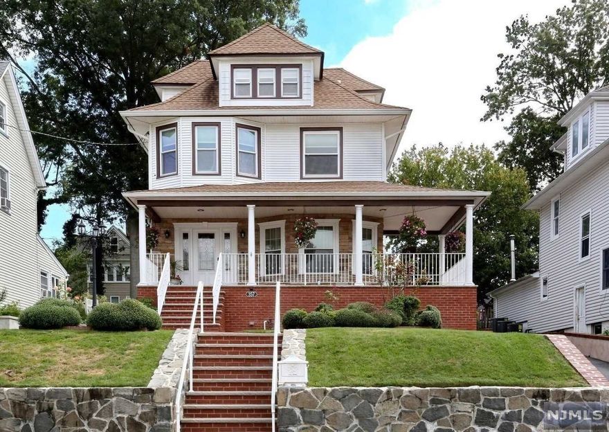 Spectacular 6 Bedroom, 3.5 Bath Colonial w/ Guest Suit. Come & discover its amazing extras. The wrap-around porch is stunning, w/ stone-face backdrop. Inside, the living-room, timeless, w/ original hardwood floors. A classic Formal Dining Room w/ subtle crown molding. Your modern eat-in Kitchen has lots of cabinets, granite counters, SS appliances & a Butler's Pantry (plus sliders to your perfect, covered patio w/ bluestone pavers). There is a new Powder Room. The staircase & wood floors (2nd & 3rd floors) are new. Two of the 2nd Floor's four Bedrooms have walk-in closets. The exquisite Bathrooms on the 2nd & 3rd floors have radiant heat & Bidet's w/ temperature control. The 3rd floor offers privacy w/ Study, Bedroom & Full Bath. Your basement is perfect as a Guest Suit w/ Living Room, Eat-in Kitchen area, Bedroom & Full Bath. The Garage has central heating. The storage space below the porch is bone dry. Home has all new PVC plumbing. Central Air. Come by, fall in love.