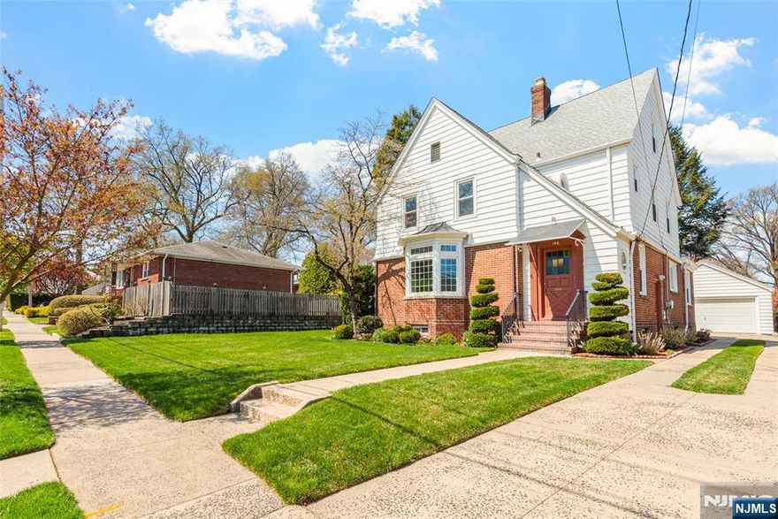 Welcome to 146 Irving Place, a beautifully maintained residence that seamlessly blends timeless charm with thoughtful updates. Gleaming hardwood floors throughout, beginning in the spacious living room, where a striking bow window fills the space with natural light. The formal dining room features French doors that open to a cozy enclosed porch, perfect for relaxing or entertaining. Just beyond, a charming swinging door leads to a generously sized eat-in kitchen that extends into a home office with a built-in desk. A convenient half bath completes the main level. Upstairs, the spacious primary bedroom offers 2 walk-in closets and a private half bath. The second bedroom boasts its own balconyâ€”ideal for morning coffee or evening stargazingâ€”while the third bedroom is comfortably sized. The finished basement provides additional living space with classic knotty pine detailing and a laundry area featuring a convenient upper-level laundry chute. Recent upgrades include a newer roof, windows, furnace, & sprinkler system. Set on a large lot with a beautifully manicured yard and a 2-car garage, this home is ideally located within walking distance of the Rutherford train station, offering a convenient commute to NYC in under 30 minutes, and quick access to all the major highways. Located within a highly regarded school system, this home offers both comfort & convenience in a sought-after community. Discover the charm of the â€œBorough of Treesâ€ and make this exceptional home your