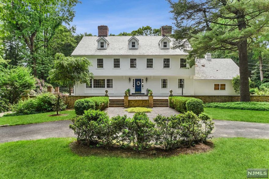 Welcome to this lovingly-maintained classic colonial set on 2.2 acres located on a cul-de-sac. Enter into the grand foyer & enjoy high ceilings, hardwood flooring & many charming features. This home has the perfect entertaining flow with over-sized rooms & 3 fireplaces. There are French doors leading to stone patios from most of the rooms.There are 5 bedrooms plus a den upstairs & 5 full baths. This home has a 3 car attached garage along with a 3 car detached garage that has a back entrance from Chestnut Ridge Rd. Other features include:an in-ground pool, security system & full finished basement. This is a very special home that is not to be missed.