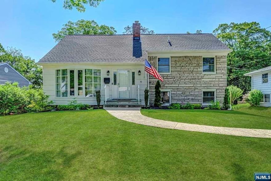 This smartly updated home is finished beautifully on all four levels. Situated on a pretty, tree-lined, residential street on a lush and foliated 1/5 acre parcel; our handsome subject was fully remodeled in 2020 to include roof, electrical and plumbing throughout the home. A bluestone entry reveals a bright and modern interior of soft hues featuring an expansive living level with a wide, open configuration. The large soft-seating area opens to a spacious dining area directly adjacent to the gorgeous quartz & stainless steel 'Country Kitchen.' The smartly equipped kitchen sports gleaming white cabinetry, a porcelain farm-style sink, a subway tiled backsplash, bar seating, separate dining, recessed illumination & a new sliding glass door leading to a fabulous, new, 16' x 16' maintenance-free deck. H/W floors run throughout the home's main level. The primary bedroom offers H/W, recessed illumination & a gorgeous new bathroom w/an oversized frameless shower, double vanity & marble flr