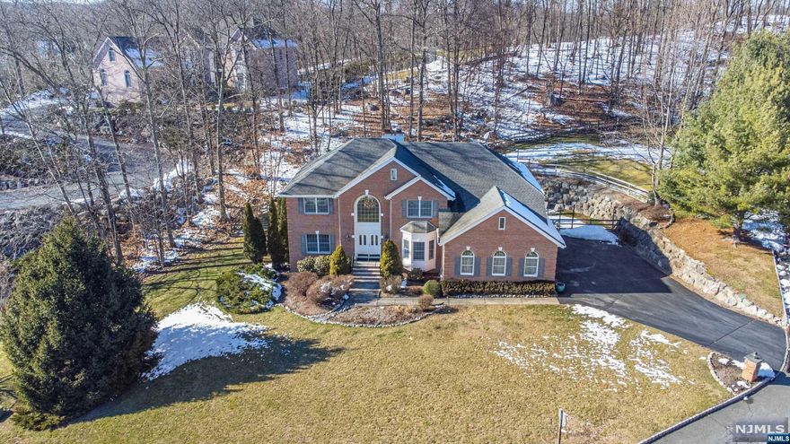 Welcome to this traditional Center Hall Colonial in Ringwood's esteemed Fountain Springs, nestled on a premium corner lot. This 3,700 sq ft gem on 1-acre blends colonial charm with modern needs. Its inviting kitchen, with trendy white cabinets, embodies a warm country feel, serving as the home's vibrant heart. The layout includes office space and a versatile basement featuring a bedroom, full bath, family room, and kitchenette, perfect for entertainment or extended living. The fenced yard offers tranquility and privacy. A unique find in Ringwood, this home combines peaceful living with convenience, close to Skyline Drive and Routes 208 and 287, inviting you to embrace a lifestyle of natural beauty and tranquility.