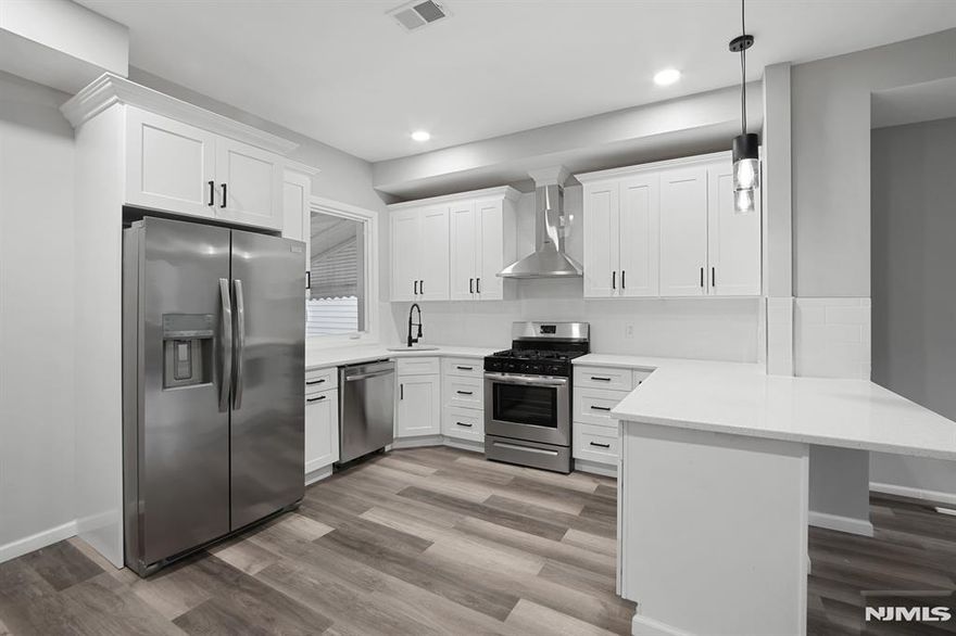 Stunning completely renovated single-family home for rent perfectly situated off Communipaw. Spacious 2 bedrooms and 2.5 baths. Well-appointed kitchen with a stainless steel Fridgidaire appliance package, including a french door refrigerator, gas stove, microwave, and dishwasher. Modern cabinets with black hardware, vented hood, pendant lighting and overhang counters add a contemporary touch to the kitchen. Upgraded bathrooms with stylish tile, dual flush toilets and modern vanities. Enjoy the convenience of central AC and forced hot air for comfortable living. Washer and dryer conveniently located in the finished basement. Private backyard for outdoor relaxation and entertainment. Excellent location, with easy access to train, bus, shopping centers, parks, and schools. Tenant responsible for 1.5-month security deposit. Tenant to cover all utilities, including water. Only one Pet may be considered with approval from the landlord, and an additional fee may apply.