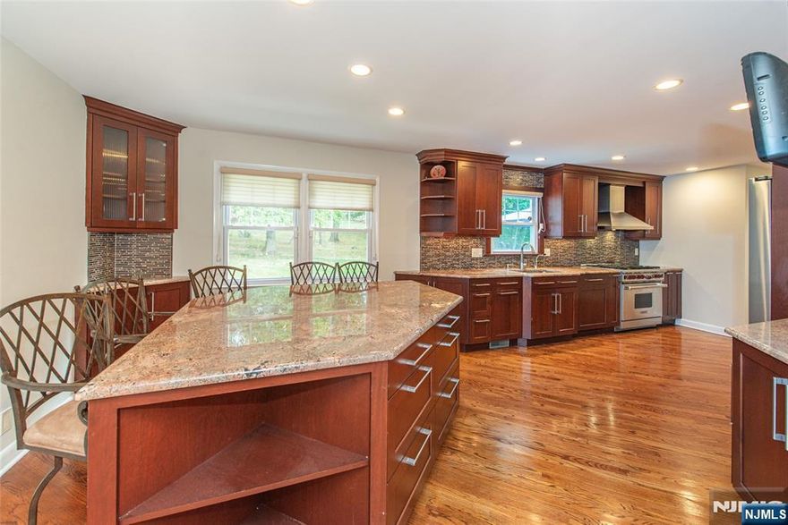 Feeling a little cramped in your current home? Tucked away on a quiet cul-de-sac, this oversized Colonial checks all the boxes: a spacious main level with a modern eat-in kitchen with SS appliances + center island with seating for 5, powder room, formal living room & and awesome large family room that opens to a sun-drenched 4-season sunroom. Upstairs, you'll find 5 spacious bedrooms all with generous closet space PLUS a primary suite with full bath. Additional features include a 2-car garage, 2 tier Trex deck overlooking rear yard, basement with storage & generator. The West Caldwell lifestyle features convenient access to the best restaurants and pubs in Caldwell's famous downtown, top rated schools, parks, 2 town pools, NYC transportation, free summer concerts at the Gazebo and so much more!