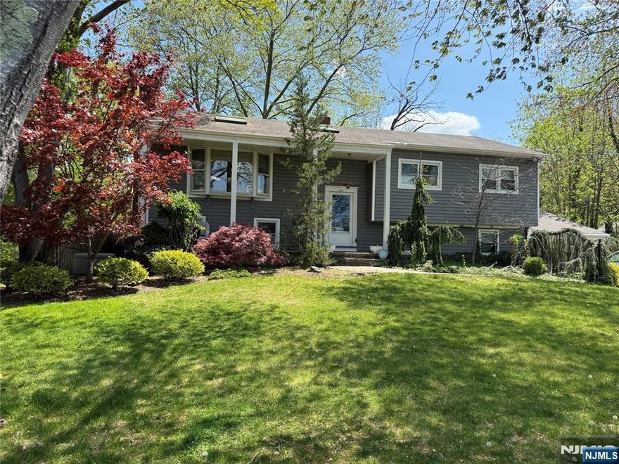 Situated on an extremely private lot, almost half an acre. In-ground pool. Perfect for extended family. Ground floor has two car garage, office, waiting room, powder room, bedroom, full bath, family room, recreation room. First floor has a living room with fireplace, dining room, kitchen, family room, laundry, full bath, two bedrooms, and a primary suite with a full bath. Sold as is.