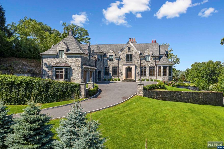 CLASSIC ,ELEGANT& TIMELESS ARCHITECTURE,DESIGNED BY JAMES PARAGANO,DEFINE THIS ELEGANT STONE MANOR SET ON OVER ONE ACRE.THE PRISTINE HOME SHOWCASES LUXURIOUS LIVING SPACE WITH SOARING CEILING & ARCHITECTURAL MILL WORK THROUGHOUT.A GRACIOUS 2 STORY ENTRANCE FOYER SHOWCASES 1 OF 5 LIMESTONE FIREPLACES,WHICH SETS THE TONE FOR THE MAIN LEVEL WITH GREAT ROOM & FIREPLACE,FRENCH DOORS TO PATIO,FORMAL L/R,BANQUET D/R WITH SURROUND SOUND,MAHOGANY LIBRARY,GOURMET KITCHEN & BREAKFAST AREA OVERLOOKING SPECTACULAR PATIO WITH FIREPLACE AND ELECTRIC SCREENS,PLASMA TV & INFINITY POOL AND ELECRIC AWNINGS W/LED LIGHTS L,B/R ENSUITE AND POWDER ROOM COMPLETE THIS LEVEL.THE 2ND LEVEL ENJOYS A SERENE PRIMARY SUITE W/FP & LUXURIOUS MASTER BATH.4 ADDITIONAL BEDROOMS W/BTH,LR W/ 2 SETS OF WASHERS/DRYERS.WALKOUT FINISHED LOWER LEVEL W/SOPHISTICATED THEATER, BR/FULL BTH. STATE OF THE ART GYM,STATE OF THE ART SMART HOME FEATURING CRESTRON AUDIO,GEOTHERMAL EFFICIENCY, FULL HOUSE GENERATOR & 3 CAR GARAGE.