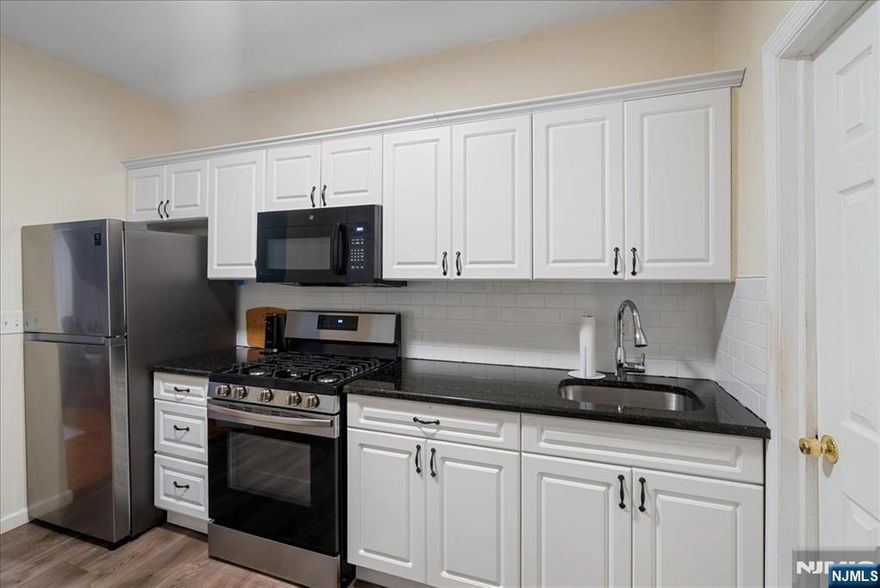 Newly renovated 2-family home in the heart of North Newark, offering the perfect blend of updates and prime location! Each unit features 3 spacious bedrooms and 1 full bathroom, with thoughtfully designed layouts ideal for both owner-occupants and investors alike.Enjoy brand-new private decks off each unit; perfect for morning coffee, outdoor dining, or relaxing in your own space. Along with a private fenced backyard for additional outdoor enjoyment.Situated just steps from Branch Brook Park, near the iconic Cathedral Basilica of the Sacred Heart, and only minutes to Newark Broad Street Station, this property offers unmatched convenience with easy access to NYC transportation, recreation, and local amenities.Delivered vacant, this is a rare opportunity to set your own rents or live in one unit while generating income from the other. Don't miss your chance to own a turnkey multi-family in one of Newark's most desirable locations!