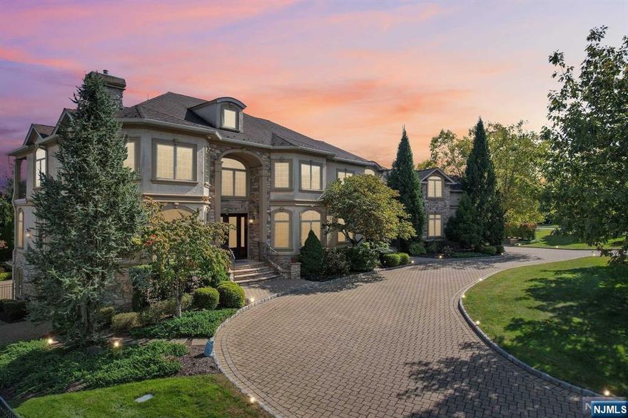 Experience Luxury Living in BEL AIR WOODS! The ONLY ONE on the market, this Stately COLONIAL is set on .57 Acres in Livingston's NEWEST &MOST AFFLUENT neighborhood. Enter into ELEGANT Double-Chandelier Foyer w/ Architectural Digest inspired Staircase. The main level is Entertainer's Dream featuring a FORMAL Living Room with a GAS Fireplace, a sophisticated home OFFICE, and a luxurious Family Room with COFFERED ceilings, flowing seamlessly into a Chef's Dream Eat-In Kitchen w/huge CENTER ISLAND, SS appliances & SLIDER to deck overlooking PRIVATE Swimming Pool. Placed for privacy on the other side of the house, find a Full Bath and Guest Bedroom with a PRIVATE ENTRANCE. 2nd Level hosts Front-to-Back True 900+ sq ft MASTER SUITE with Double-Sided GAS Fireplace, 2 Walk-in Closets, Sitting Room/Office & SPA-Like En-Suite Bath. Additional 4 bedrooms (including a large BONUS Room) + 3 Full Bathrooms. Over 8300+ sq ft of Living Space including FULL FINISHED WALKOUT Basement