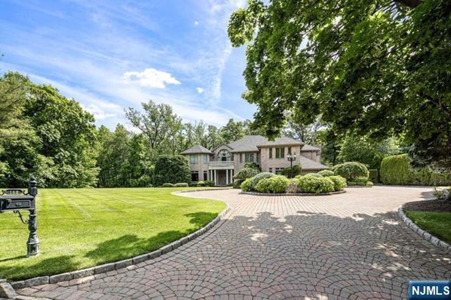 PRICE IMPROVEMENT! Located on one of Bergen County's most prestigious and sought after streets, this home is impeccable in every way. Designed for total privacy and lavish entertaining. Natural light floods the home and the sounds of nature surround the property from the tranquil pond. A gourmet chef's kitchen, complete with high end appliances and fireplace, overlooks pool and patio. The luxurious primary suite with separate sitting room with fireplace is the perfect place to unwind. Meticulously maintained, no detail overlooked. This is truly a special property. Please call Annitsa @ 201-406-3650 for more information