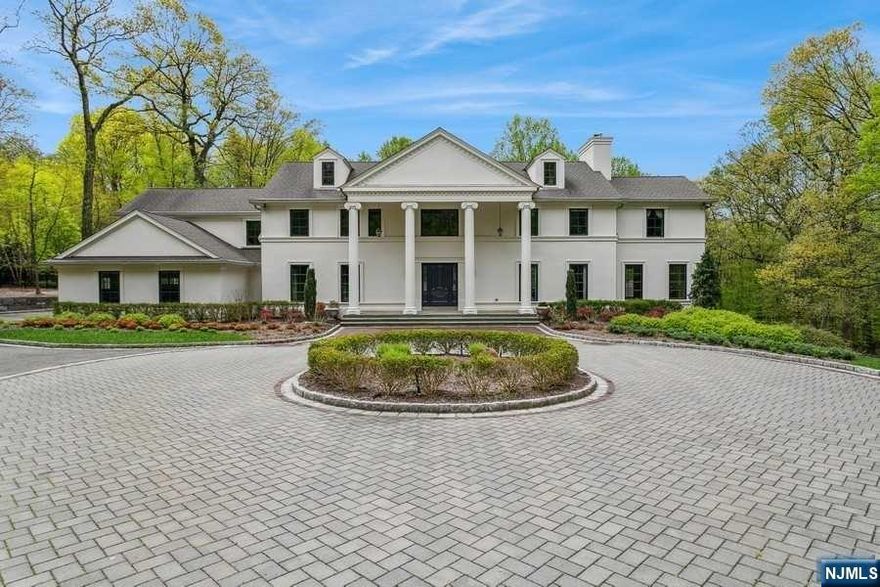 This luxury-class gated residence set on Very Private & Tranquil Cul de Sac in prestigious Alpine. 2+ park like acres & a central paved driveway offering perfect home for entertaining. A welcoming two story entrance foyer to banquet sized dining rm, formal living rm w/fpl to balcony to look out to lush property, library w/built-ins & fpl., chef's kitchen to the large patio w/built in outdoor kitchen, a sun filled breakfast rm to mud rm w/access to 3 car heated garage. Sun drenched family rm w/fpl and custom wet bar, palladium windows overlooking the private grounds. 2nd level has a spacious principal suite w/fpl and dressing rm with a Juliette balcony, two en suite bedrooms, and another two bedrooms w/Jack & Jill fbath and laundry, and side stairwell. Enjoy a lower level 10 seat home theater, fitness rm, hobby rm, w/fbath and rec rm access to stunning heated in ground pool with fully equipped cabana. Great community, excellent school systems, low taxes and only 11 miles from NYC