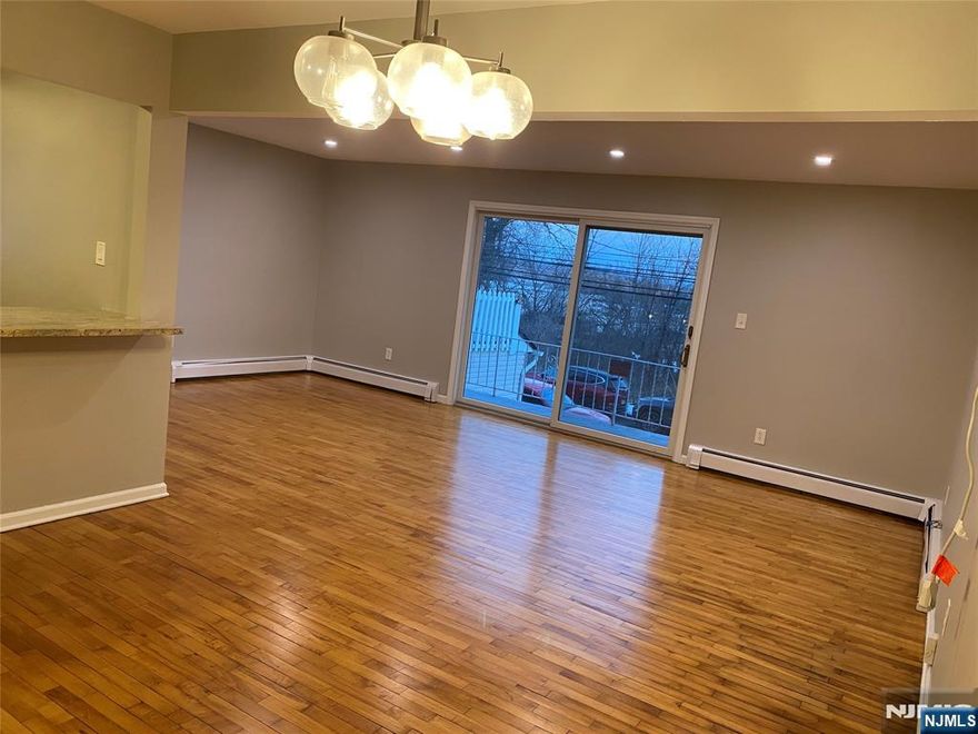 Lovely renovated duplex apartment - 1st & ground floor with separate entrances. Features primary bedroom with half bath, 2 additional bedrooms, recently done NEW full bath & modern kitchen with lots of cupboards & under cupboard lighting. Stainless-steel appliances, granite countertops, and Island. Living room, dining area, with recessed lighting & sliding doors to balcony. Refinished hardwood floors throughout. Laundry hookups on the ground floor, includes use of yard, 1 parking space. MOVE IN READY! Don't miss this great opportunity! OWNER HOLDS NJ REAL ESTATE LICENSE. *** A MUST SEE TO TRULY APPRECITATE - FINISHED ABOVE GROUND FLOOR SPACE WITH WET COFFEE BAR