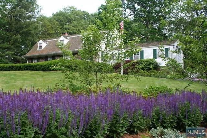 PICTURE PERFECT SETTING...SET HIGH ON TENAFLY'S EAST HILL, ON A PRIVATE CUL-DE-SAC IS A BEAUTIFUL CENTER HALL COLONIAL. INVITING ENTRY FOYER,LARGE FORMAL LIVING ROOM WITH FIREPLACE, FORMAL DINING ROOM, HANDSOME LIBRARY, EXPANSIVE UPDATED KITCHEN WITH BREAKFAST AREA, POWDER ROOM; WHICH HAS ACCESS OUT TO THE REAR PATIO AND CAN BE USED AS A CABANA FOR THE POOL, GORGEOUS GREAT ROOM WITH A PALLADIUM WINDOW, HIGH CEILING, EXTENSIVE TRIM WORK AND A FIREPLACE, EN SUITE BEDROOM, MUDROOM AREA & LAUNDRY RM COMPLETE THE MAIN FLOOR. SECOND FLOOR FEATURES A PRIMARY BEDROOM SUITE, 2 ADDITIONAL BRS AND FULL BATHROOM. LOWER LEVEL REC AREA & STORAGE. SPECTACULAR PROPERTY WITH LARGE PATIO, GUNITE POOL AND VERY PRIVATE LUSH LANDSCAPING. EQUIPT WITH A FULL HOUSE GENERATOR. CLOSE TO THE TENAFLY NATURE CENTER, SHOPPING, SCHOOLS AND TRANSPORTATION TO NYC. TENAFLY BLUE RIBBON SCHOOLS...DON'T MISS OUT ON THIS AMAZING OPPORTUNITY!!