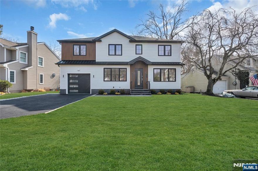 Prepare to be captivated by this stunning new construction crafted on an existing foundation, seamlessly blending modern design with timeless elegance. Aprox. 3300 sq. ft.NOT including the finished basement. You'll appreciate the open and airy floor plan that exudes sophistication and comfort. Soaring 9-foot ceilings set the stage for grandeur, while an electric fireplace adds warmth and ambiance. 5" White Oak hardwood flrs, premium finishes and oversized windows that invite the beauty of the outdoors inside. The gourmet kitchen is a masterpiece. The second floor boasts a luxurious primary bedroom suite with a striking tray ceiling and dual walk-in closets. A well-appointed on-suite bedroom, two additional generously sized bedrooms, a beautifully designed hall bath, and a dedicated home office. Second-floor laundry rm. Easy access to the train, shopping, and highly regarded schools, making it perfect for those seeking both convenience and luxury. Est. tax $32,300 by town accessor.