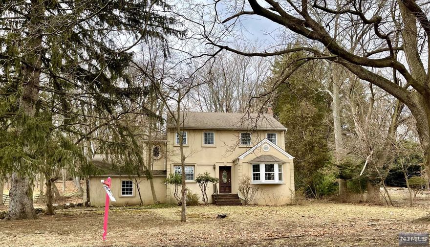 1.2 acres!!! This colonial home features 5 bedrooms, 2 full baths, living room, dining room, eat-in-kitchen, central air conditioning, full, unfinished basement and two car garage. Plenty of space to add on to house. Close to NYC bus transportation, schools, shopping and parks. Easy commute to NYC and Westchester. Sold as is. Click one the Virtual Tour!