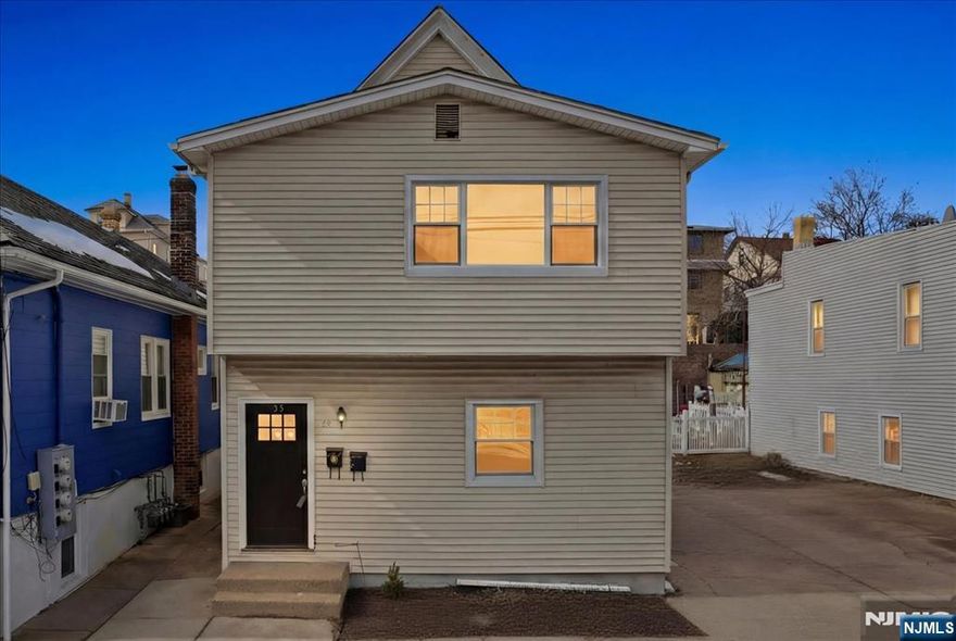 Fully renovated two-family home in Garfield offering modern upgrades and excellent space both inside and out. This turnkey property features brand-new insulation, updated electrical and plumbing systems, and beautifully renovated interiors. Each unit offers a new kitchen with modern cabinetry, updated appliances, stylish flooring throughout, and two bedrooms on each floor. The second-floor unit also includes a den/office space, perfect for working from home or additional living space. The attic is currently unfinished but offers great potential to be easily integrated into the home for additional living space. The unfinished basement provides two separate areas with laundry hookups and convenient access from the backyard. The property features a spacious yard ideal for outdoor enjoyment and entertaining. A nice size driveway provides ample off-street parking. Perfect for investors or owner-occupants seeking a move-in-ready property with strong income potential.