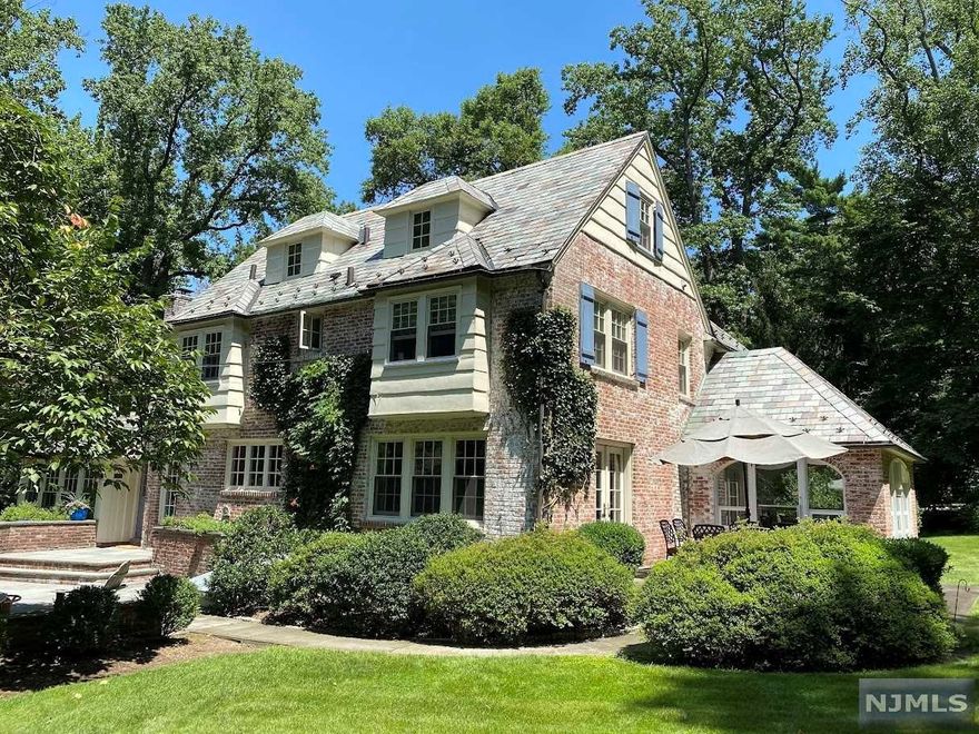 Looking for your suburban dream? Welcome to this special home on nearly an acre in the East Hill section of Englewood. This property features a stunning brick and slate home, a massive landscaped lawn, beautiful pool/ jacuzzi, private guest house, and three car garage. The house has been meticulously maintained and cared for. The property exudes charm, character, warmth and it's appeal is certainly timeless. This is the gem you've been waiting for.